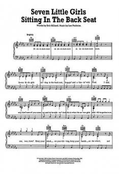 Seven Little Girls Sitting in the Back Seat 